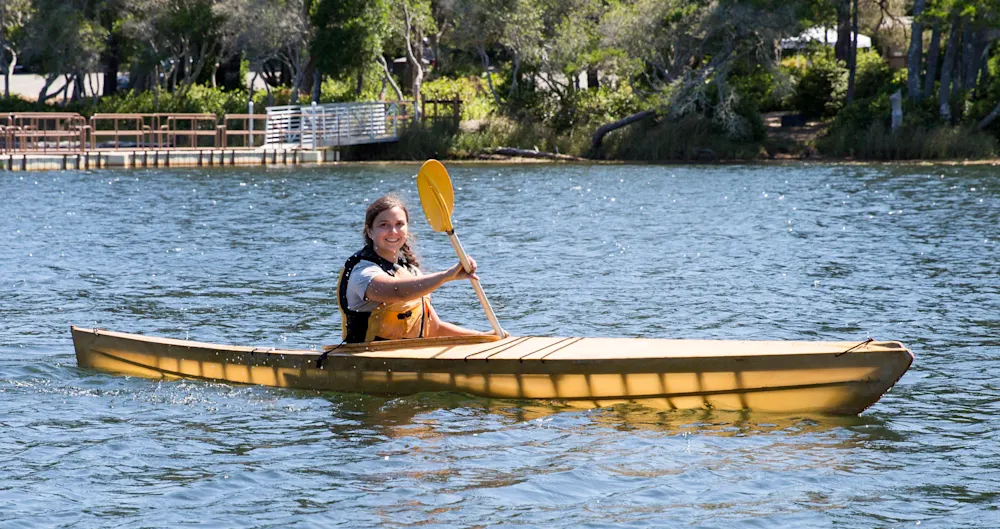 Campers paddling kayaks