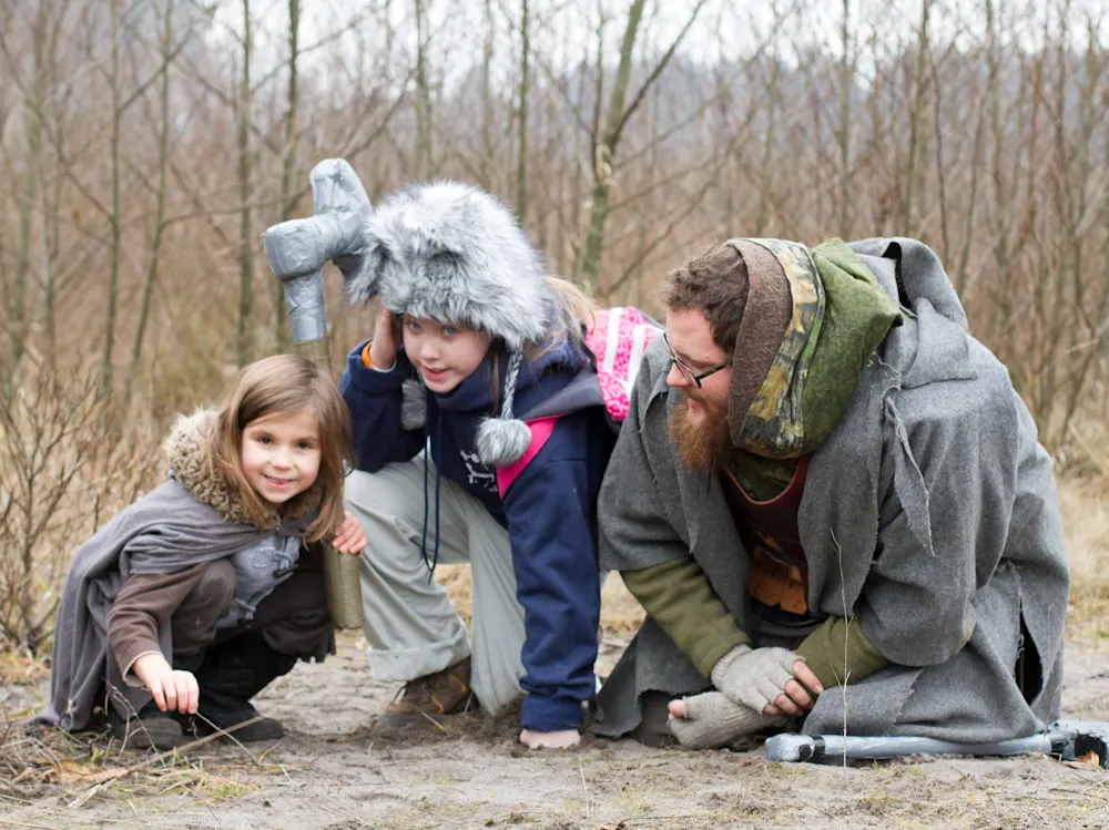 Realms role-players adventuring in the December forest