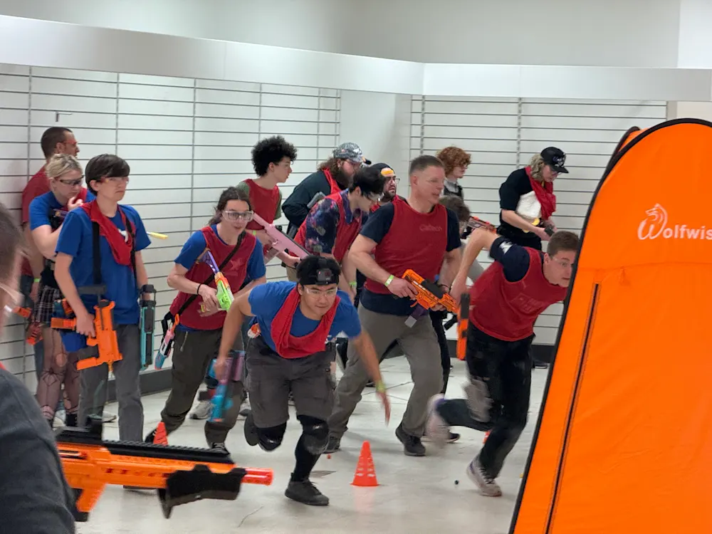 Kids in a Nerf blaster battle arena