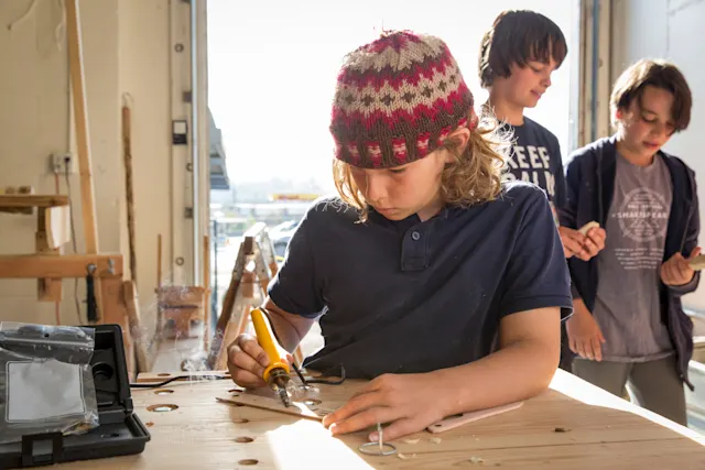 Camper woodworking in the Trackers shop