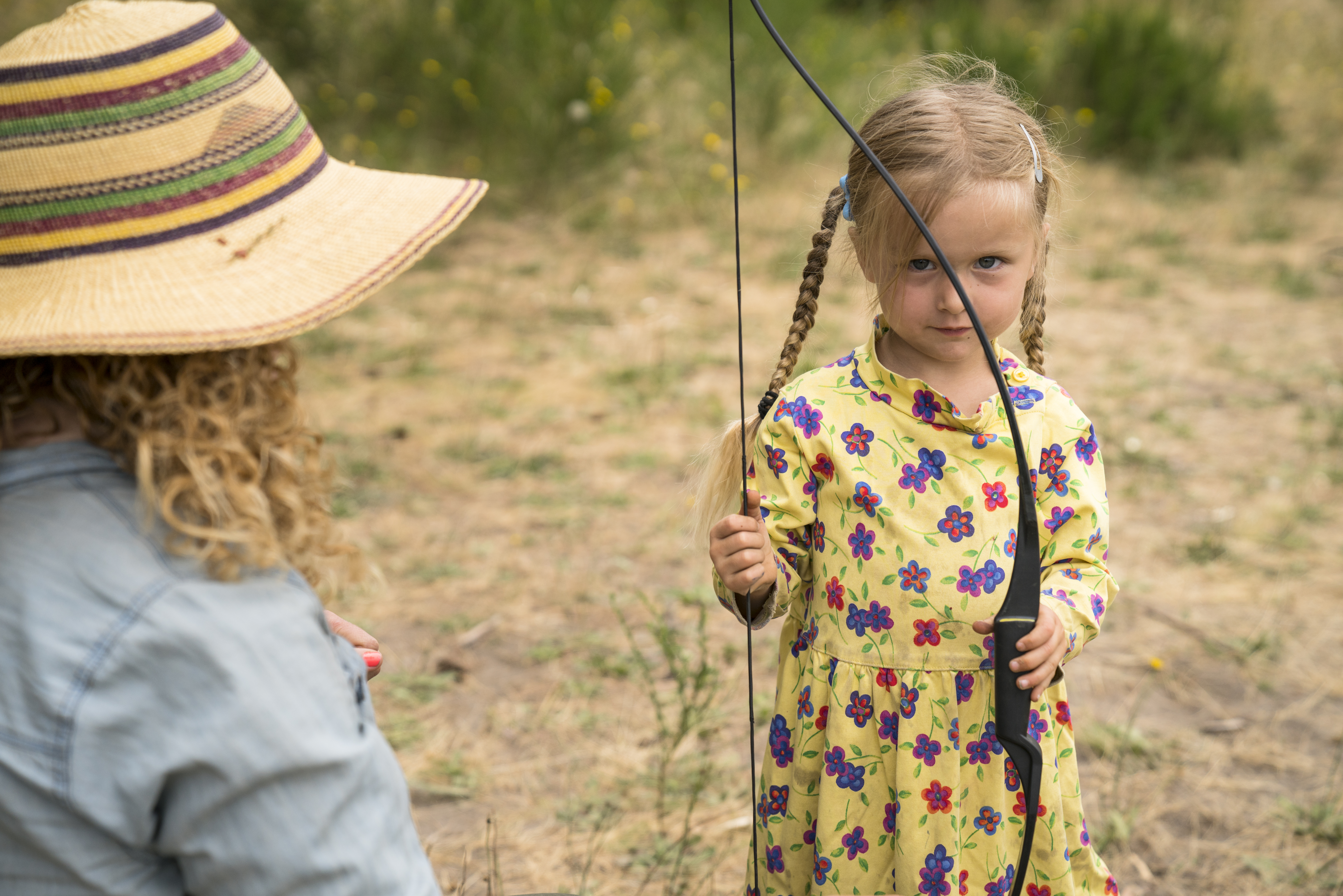 Young Rovers on the archery line with a Trackers Guide