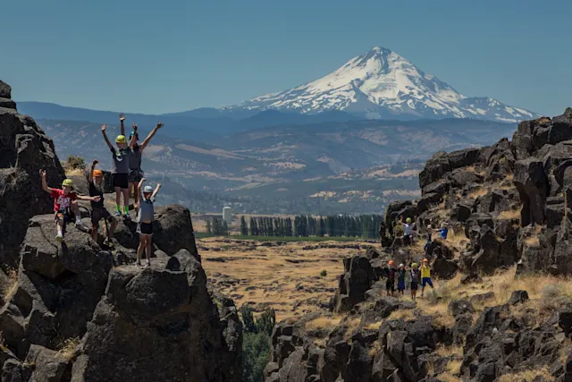 A group of campers rock climbing