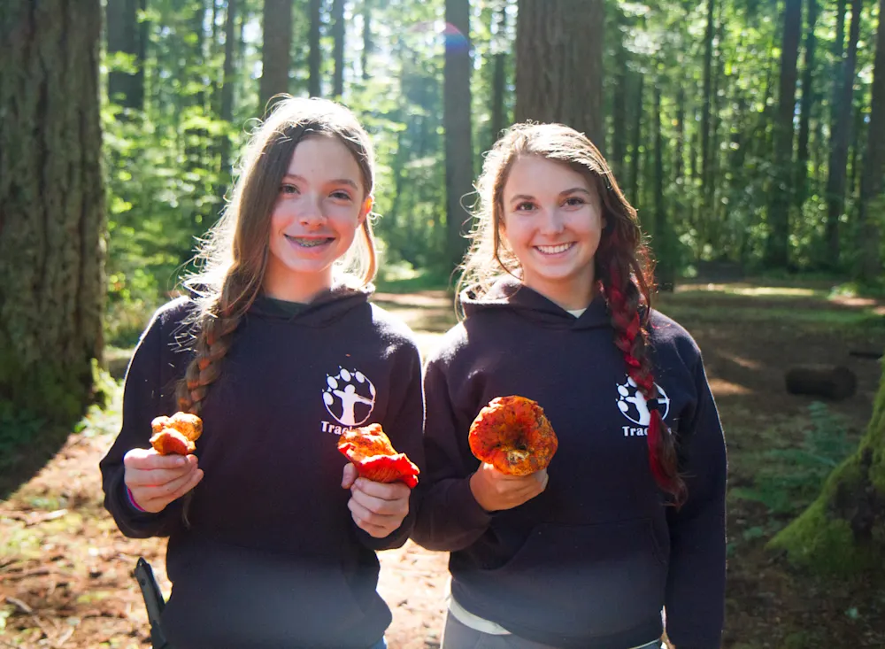Two teens with mushrooms they foraged