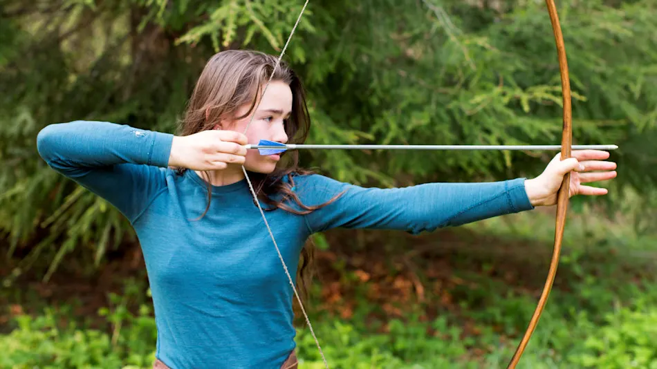 Archery apprentices drawing bows