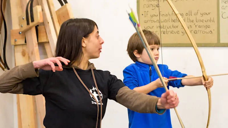 Basecamp campers learning archery at the Trackers range