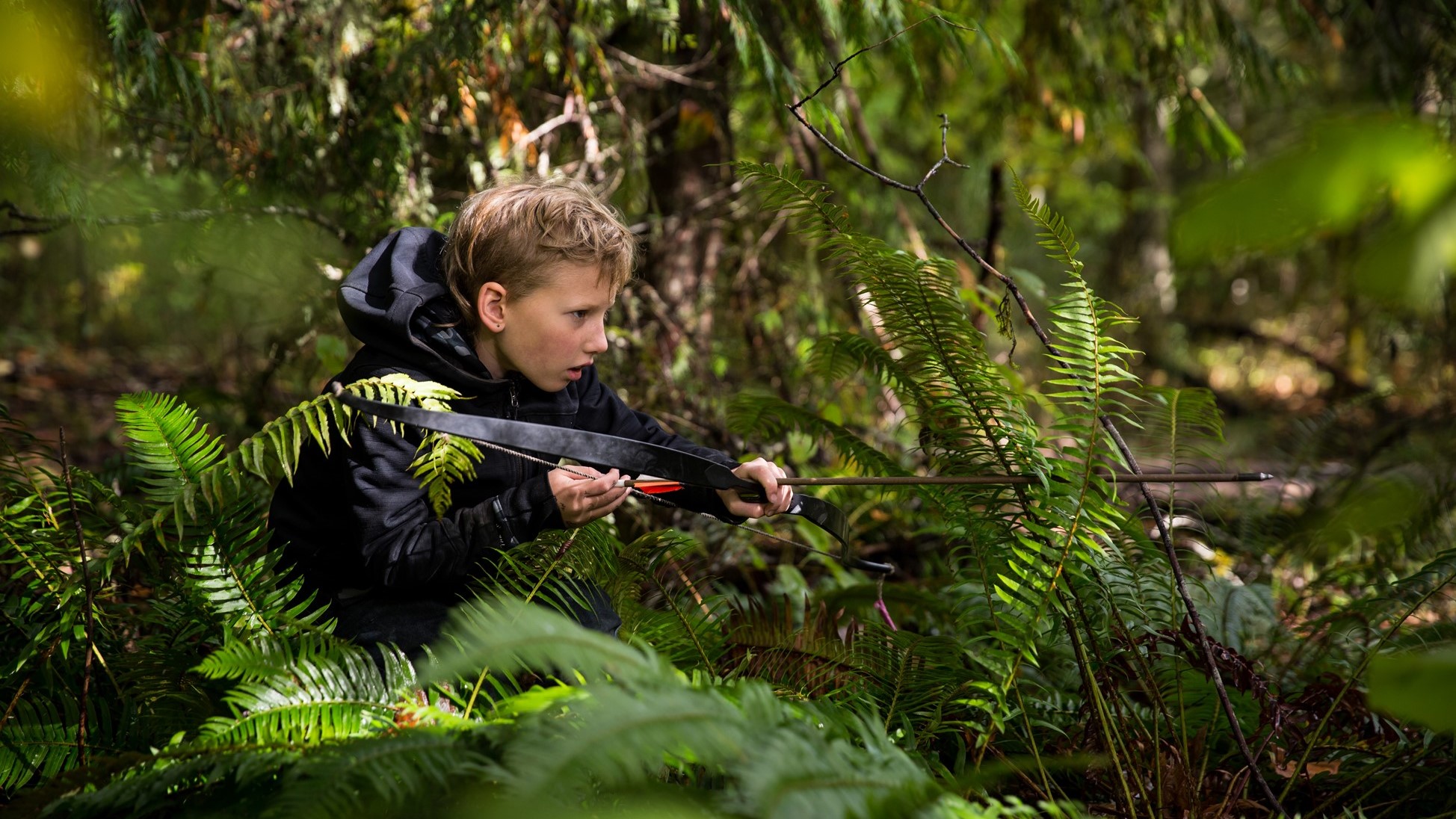 Kids camouflaged for a forest stealth scenario