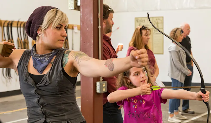 Archery range with Trackers Guides coaching kids and adults