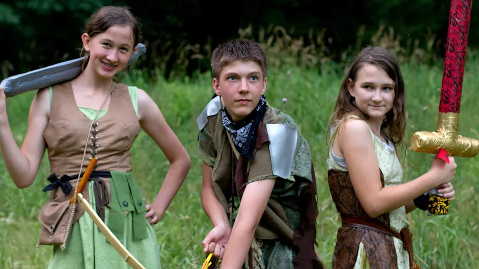 Realms campers in costume with foam swords and bows