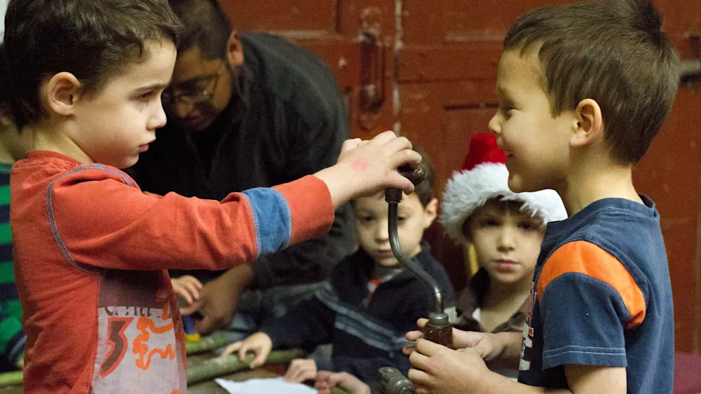 Young campers crafting handmade holiday gifts
