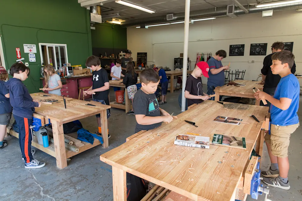 Student working with hand tools in the woodworking shop