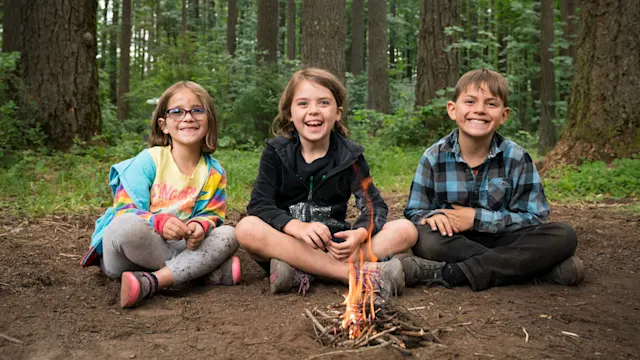 Homeschool students practicing wilderness survival