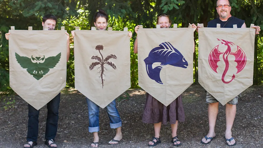 Trackers staff holding the four guild banners