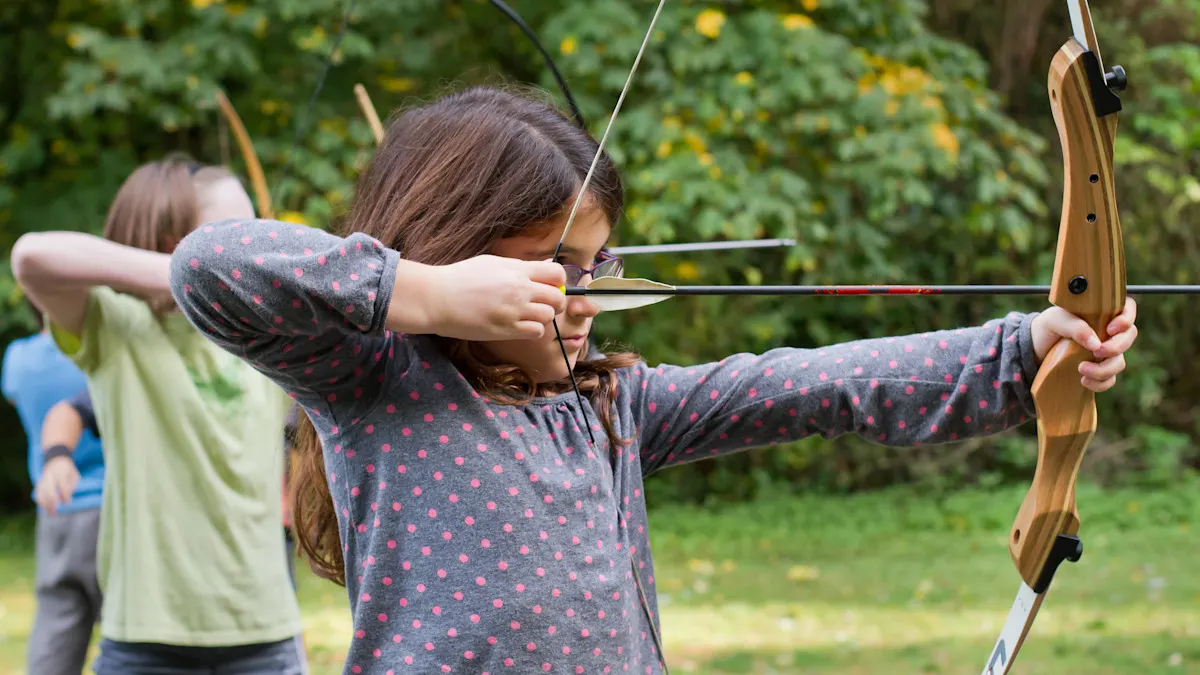 Kids practicing archery at the Trackers indoor range