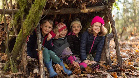 Campers exploring the winter forest together